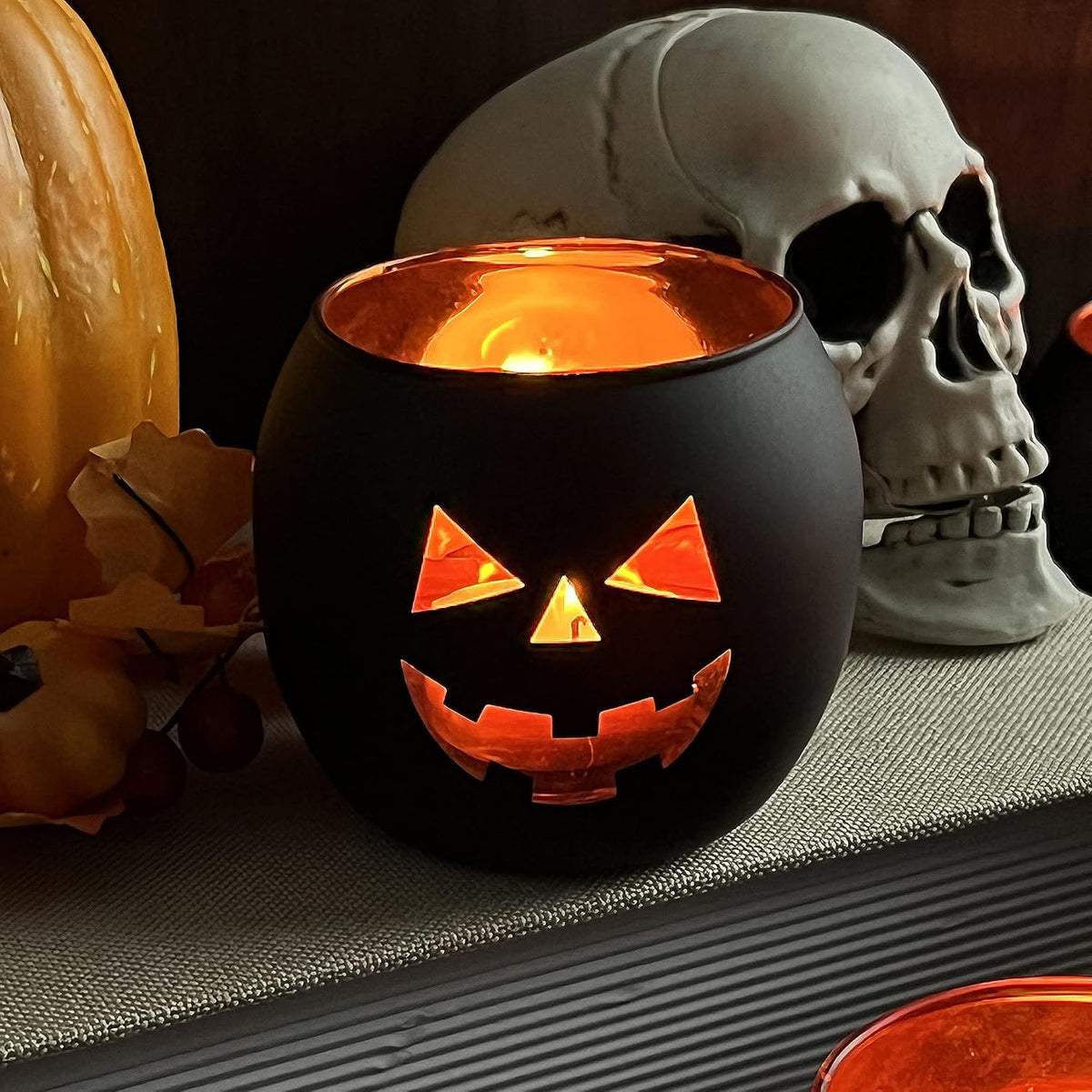 SHMILMH Halloween Table Centerpiece Candle Holders Set of 12, Black and Gold Glass Votive Holder with 6 Grimace, Tealight Holders Bulk for Halloween Party Decor