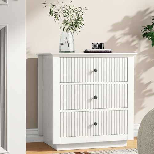 24" wide white fluted nightstand with 3 drawers on a desk or shelf