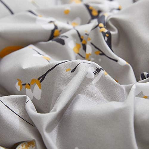 gray comforter sheet set bed in a bag on a desk or shelf