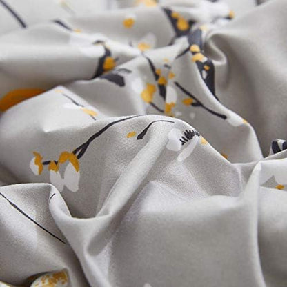 gray comforter sheet set bed in a bag on a desk or shelf