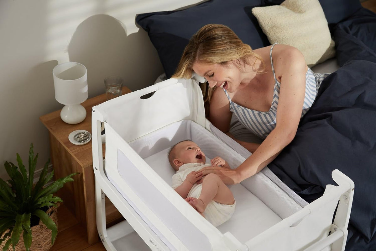 snuz snuzpod 4 bedside bassinet with mattress, white shown in use