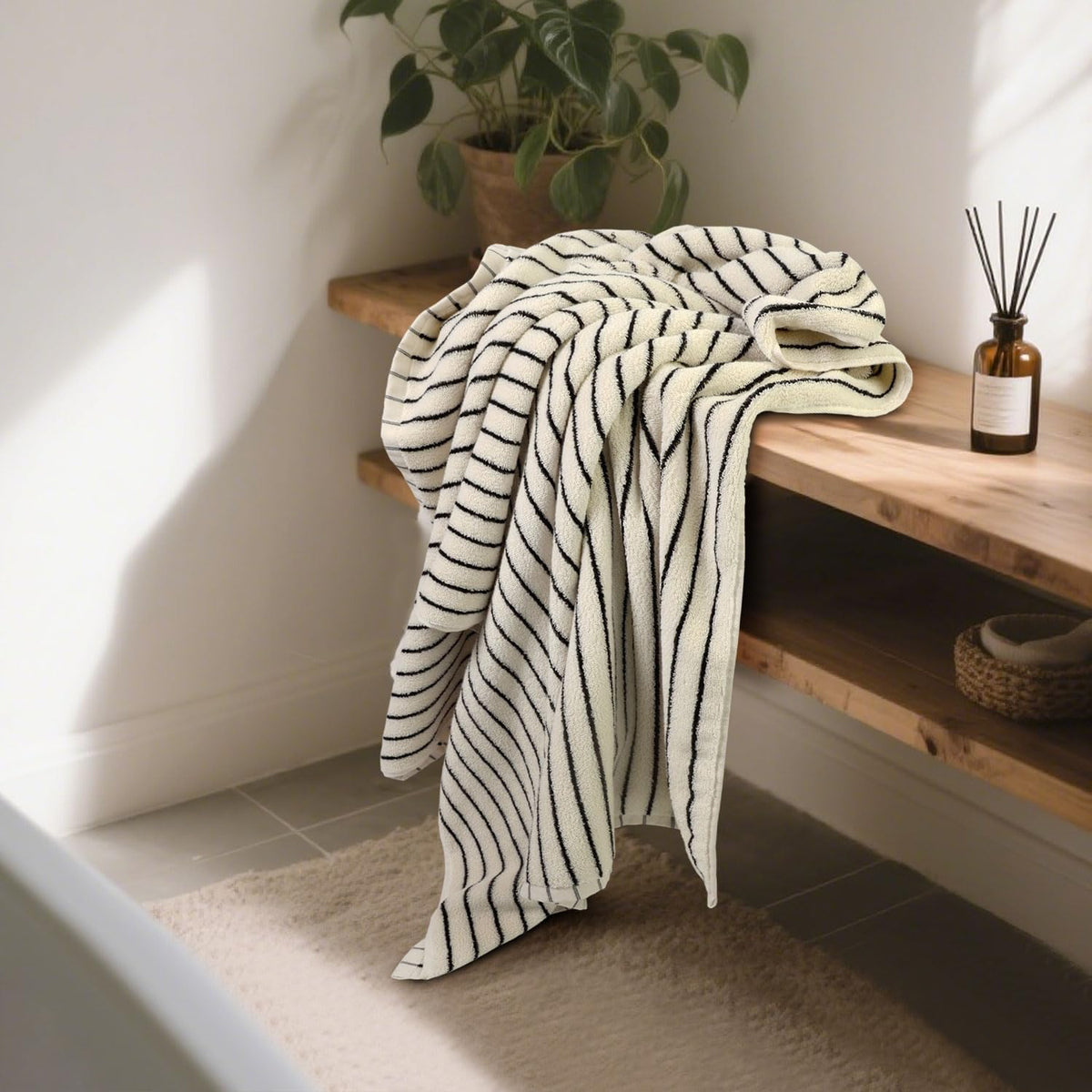 black and ivory striped bath towels set of shown in use