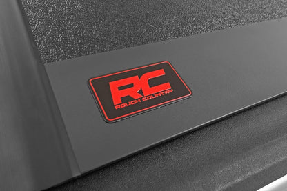 rough country hard low-profile tri-fold tonneau cover for on a desk or shelf