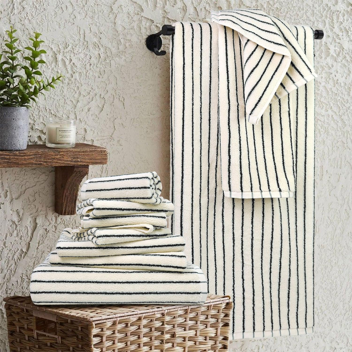 8 piece black and ivory towel set, super shown in use