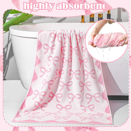 pink bow towel, 28 x 55 in 100% showing dimensions