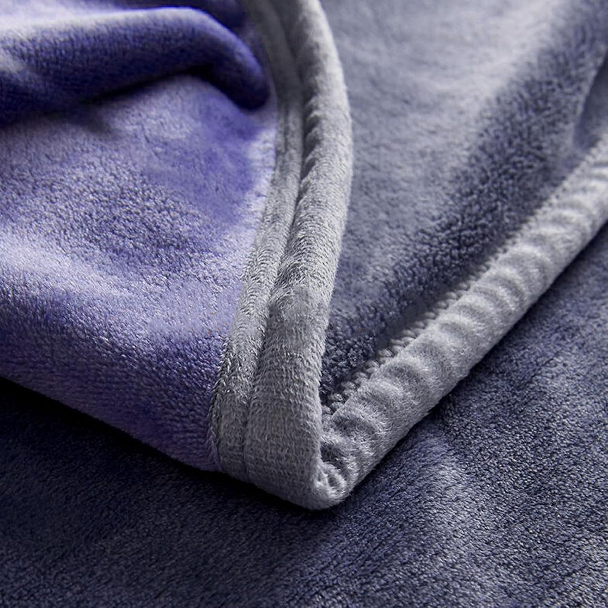 waterproof reversible bed blanket 80"x60", stain-proof cover, grey/violet, side view