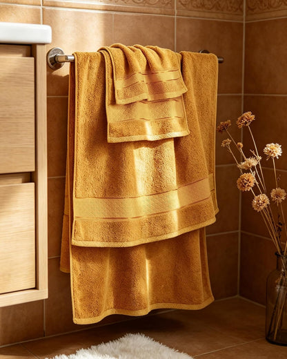 cozyart bath towel set 6 pcs, luxury gold on a desk or shelf