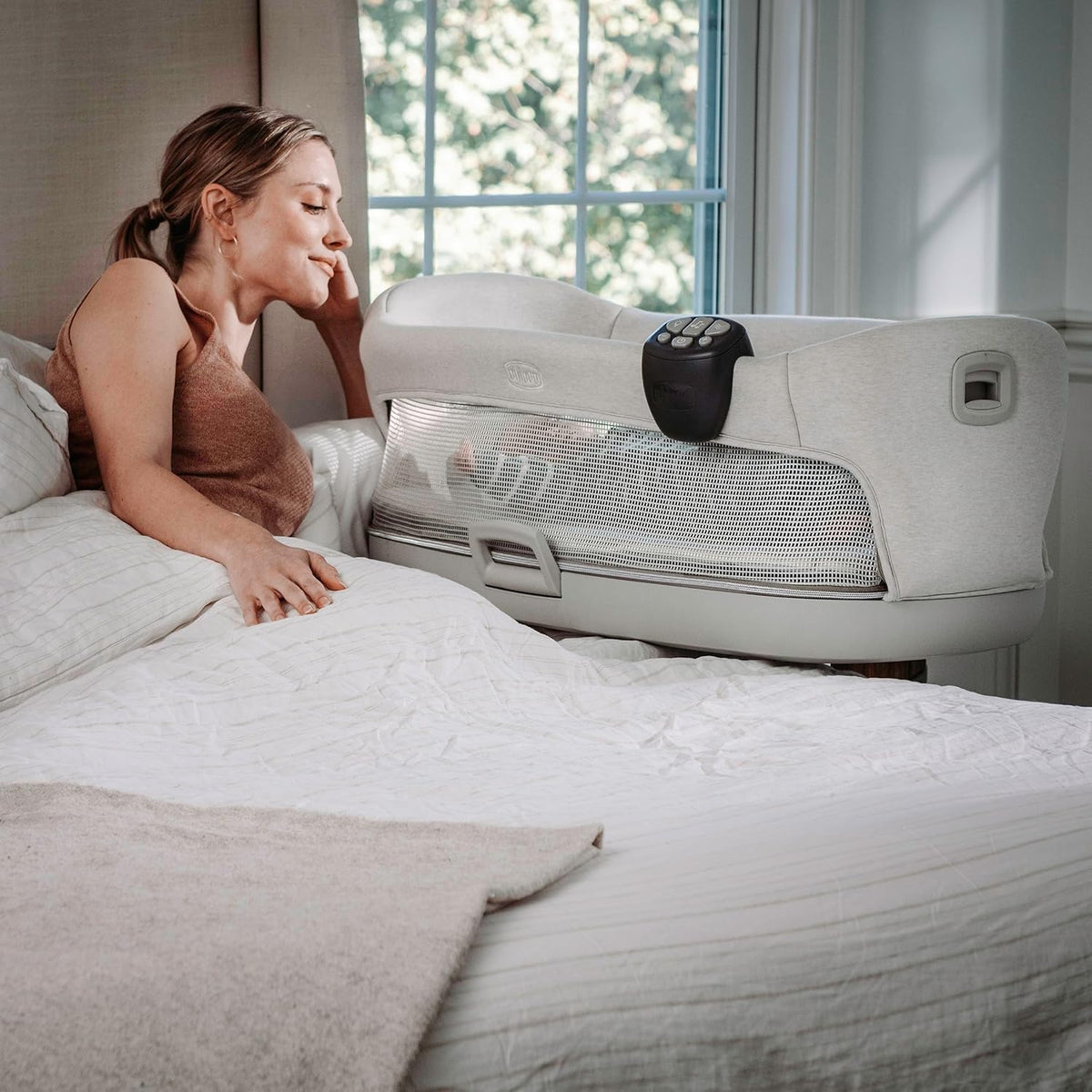 chicco close to you 3-in-1 bedside bassinet with shown in use