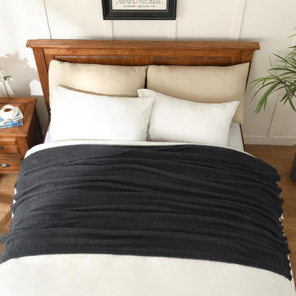 jooja knitted dark grey black throw twin size shown in use