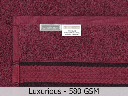 cotton craft ultra soft bath towels - 4 on a desk or shelf