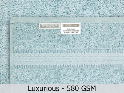 cotton craft ultra soft 6 piece towel set on a desk or shelf